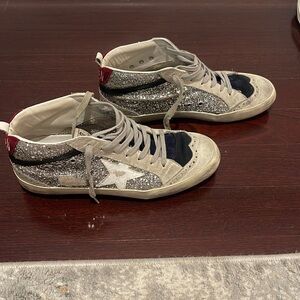 Golden sparkly shoes.